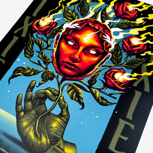 Close up of a Pixies tour poster with green text on the left and right sides of the poster reading "PIXIES" in the center is a red face with white eyes with stems, leaves, and roses on fire. Below the face is a green hand holding the stem. Below in white text are all 2026 EU tour dates.