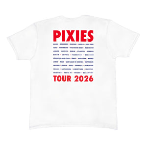 A white T shirt against a white background with red text at the top reading "PIXIES" and red text at the bottom reading "Tour 2026" in between the red text is blue text listing all the cities on the Pixies 2026 Tour.