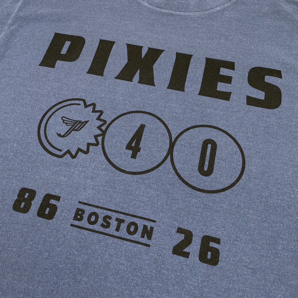 Blue Pixies t-shirt with black lettering reading "Pixies, P40, 86-26 Boston" against a white background