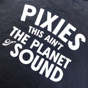 Close up of the back of a black Crewneck Sweatshirt with white text reading "Pixies This Ain't the Planet of Sound"